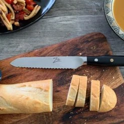 Alpha-Royal Japanese Serie 5,5" Allzweckmesser Wellen Damast-Stahl -Küchenbedarf Geschäft 10038997 de 0003 logo