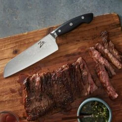 Executive-Plus Serie 7" Santokumesser 61 HRC Damaszenerstahl -Küchenbedarf Geschäft 10039011 de 0005 logo